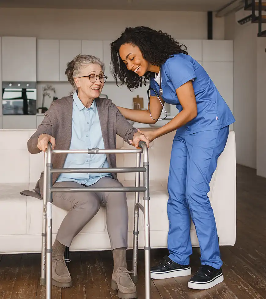 Home health nurse helping an older adult at home.